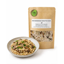 Load image into Gallery viewer, A bowl of mushroom risotto mix with cooked rice and herbs in the foreground, and a kraft stand-up pouch labeled 'MUSHROOM RISOTTO MIX' with a visible Pure Kitch logo, on a white background.