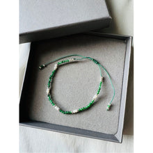 Load image into Gallery viewer, The Gaia PureKtchn London Emerald Love Bracelet features vibrant green Emerald gemstones, pearls, and sterling silver. This timeless piece symbolizes love, strengthens relationships, and promotes emotional balance and healing.
